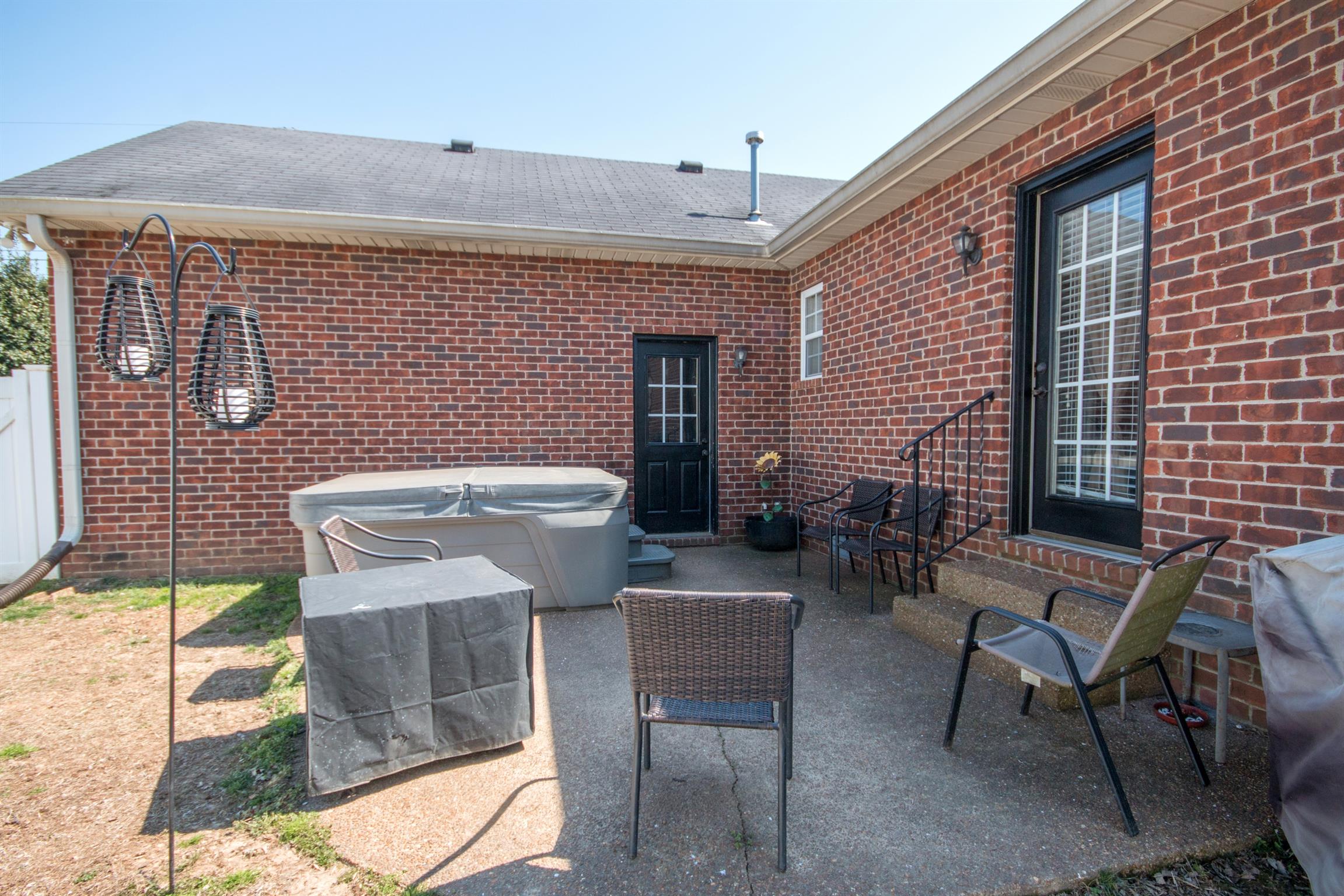 171 Abbey Road Gallatin, TN 37066 - Photo 22 of 28 a view of a patio with table and chairs and potted plants