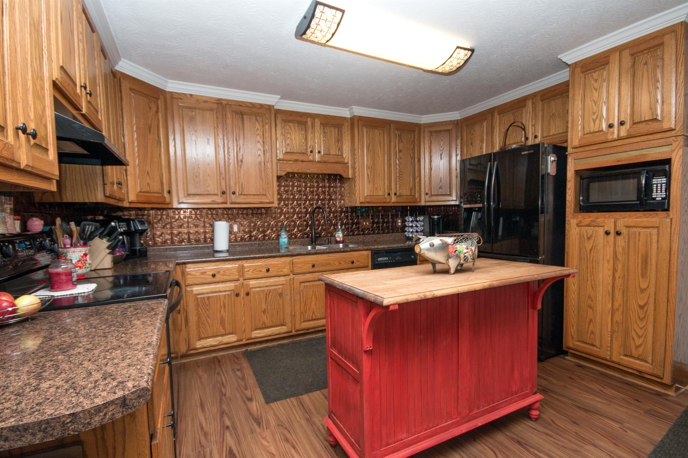 171 Abbey Road Gallatin, TN 37066 - Photo 8 of 28 a kitchen with stainless steel appliances granite countertop a stove refrigerator sink and cabinets