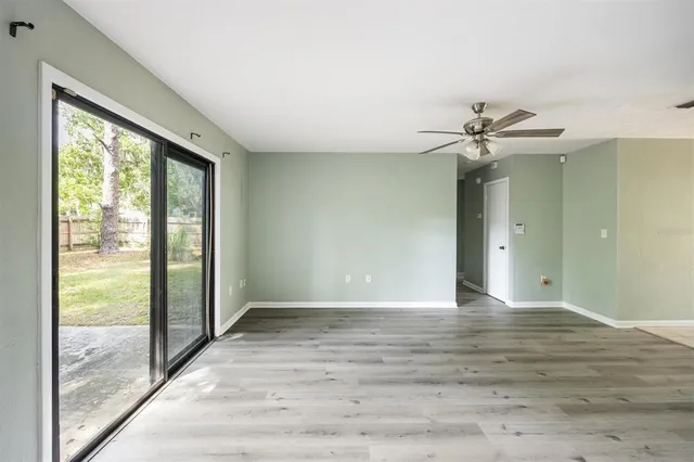 a view of an empty room with glass door