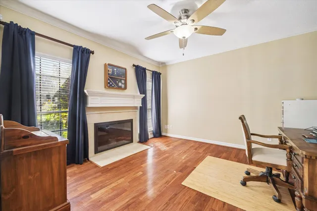 a workspace with wooden floor and a fireplace