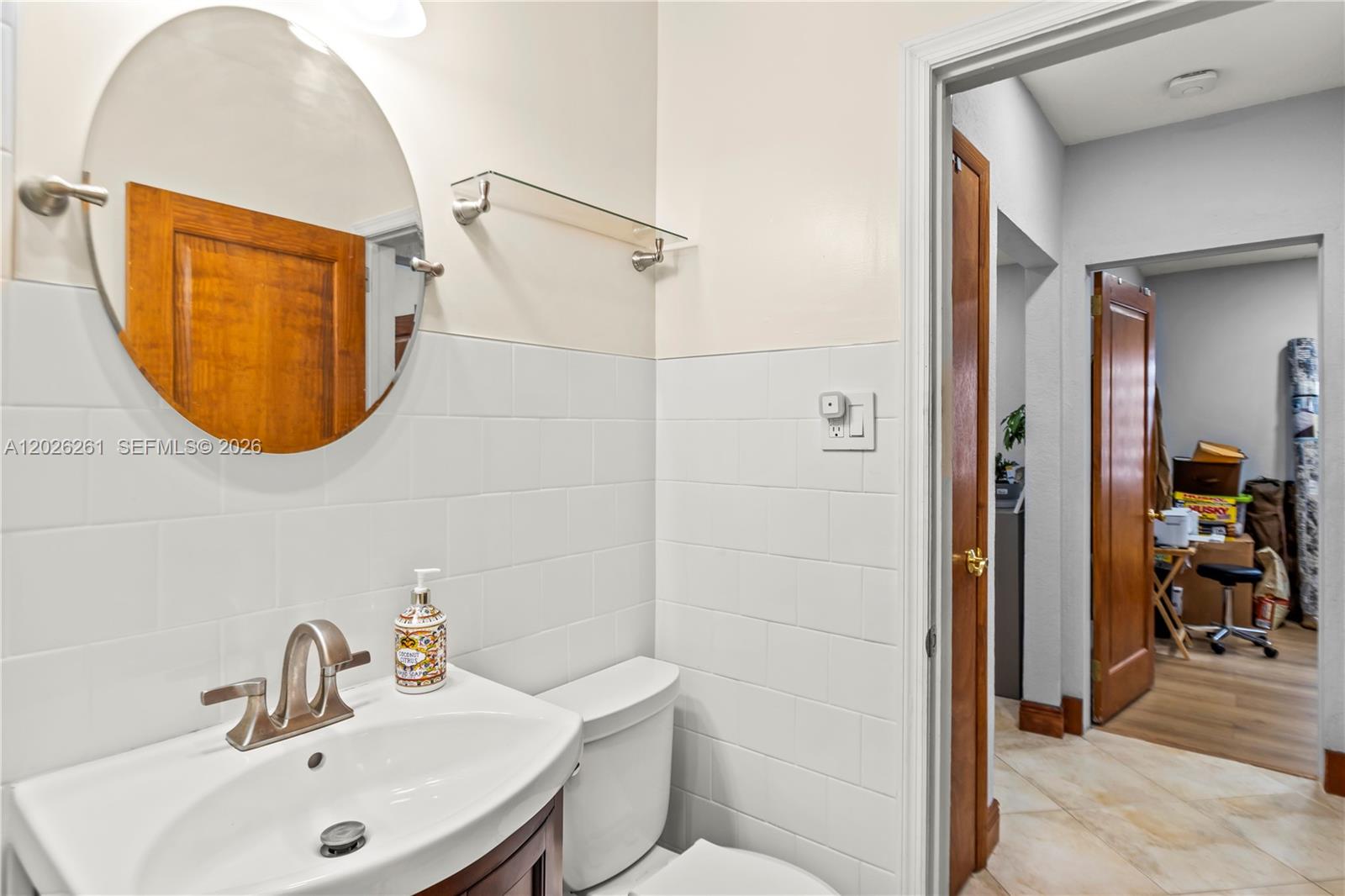 6250 Southwest 20th Terrace Miami, FL 33155 - Photo 22 of 42 a bathroom with a sink mirror and toilet