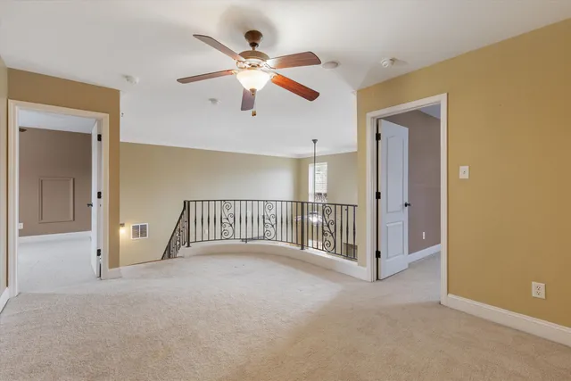 a bathroom with a sink a toilet and shower curtain