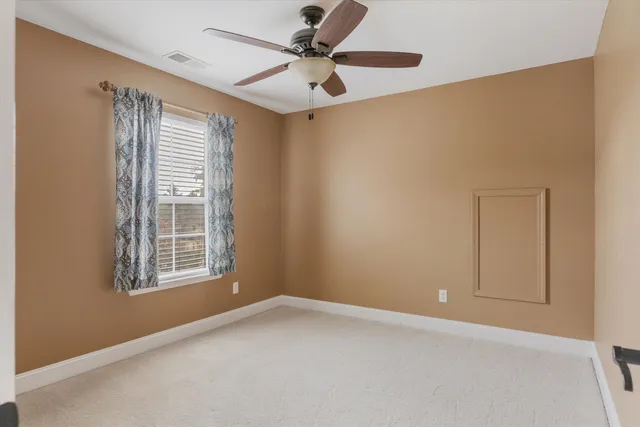en view interior of a house an empty room and chandelier fan