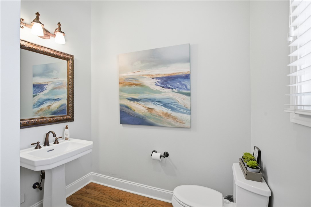 578 Sunset Point Drive West Union, SC 29696 - Photo 14 of 46 This clean and functional bathroom features hardwood flooring and a classic pedestal sink.