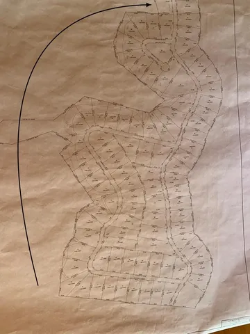 a view of outdoor space with green field and trees