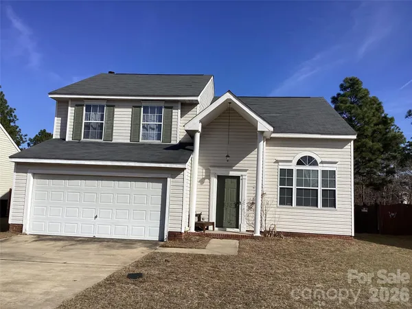 a front view of a house with a garage