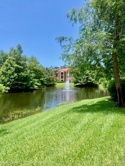 1180 Reserve Way, Unit 206 Naples, FL 34105 - Photo 13 of 22 an aerial view of a house with a yard and lake view