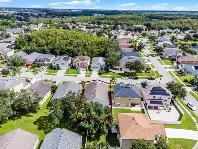 an aerial view of residential houses with outdoor space