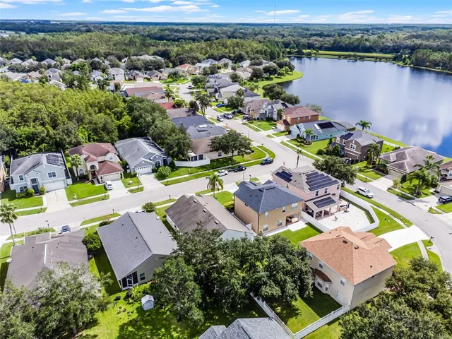 an aerial view of residential houses with outdoor space