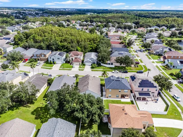 an aerial view of residential houses with outdoor space