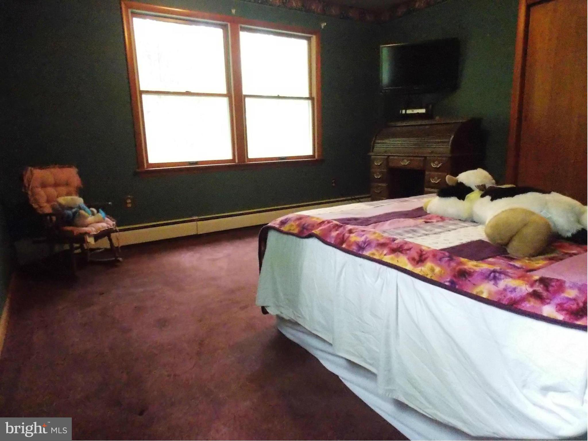 3039 Menges Mill Road Taneytown, MD 21787 - Photo 12 of 25 a bedroom with a bed and a window