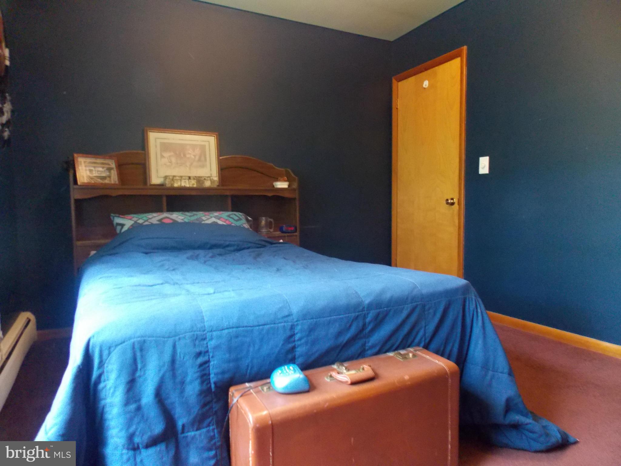 3039 Menges Mill Road Taneytown, MD 21787 - Photo 16 of 25 a bed room with a bed and a television