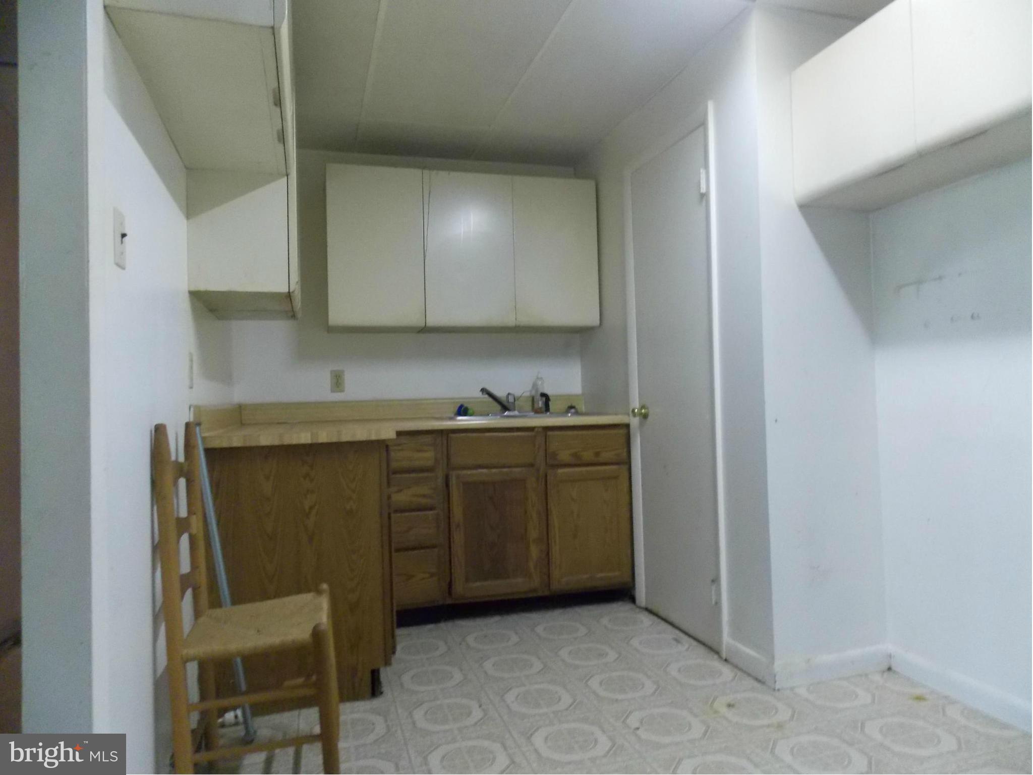 3039 Menges Mill Road Taneytown, MD 21787 - Photo 20 of 25 a kitchen with cabinets and chairs