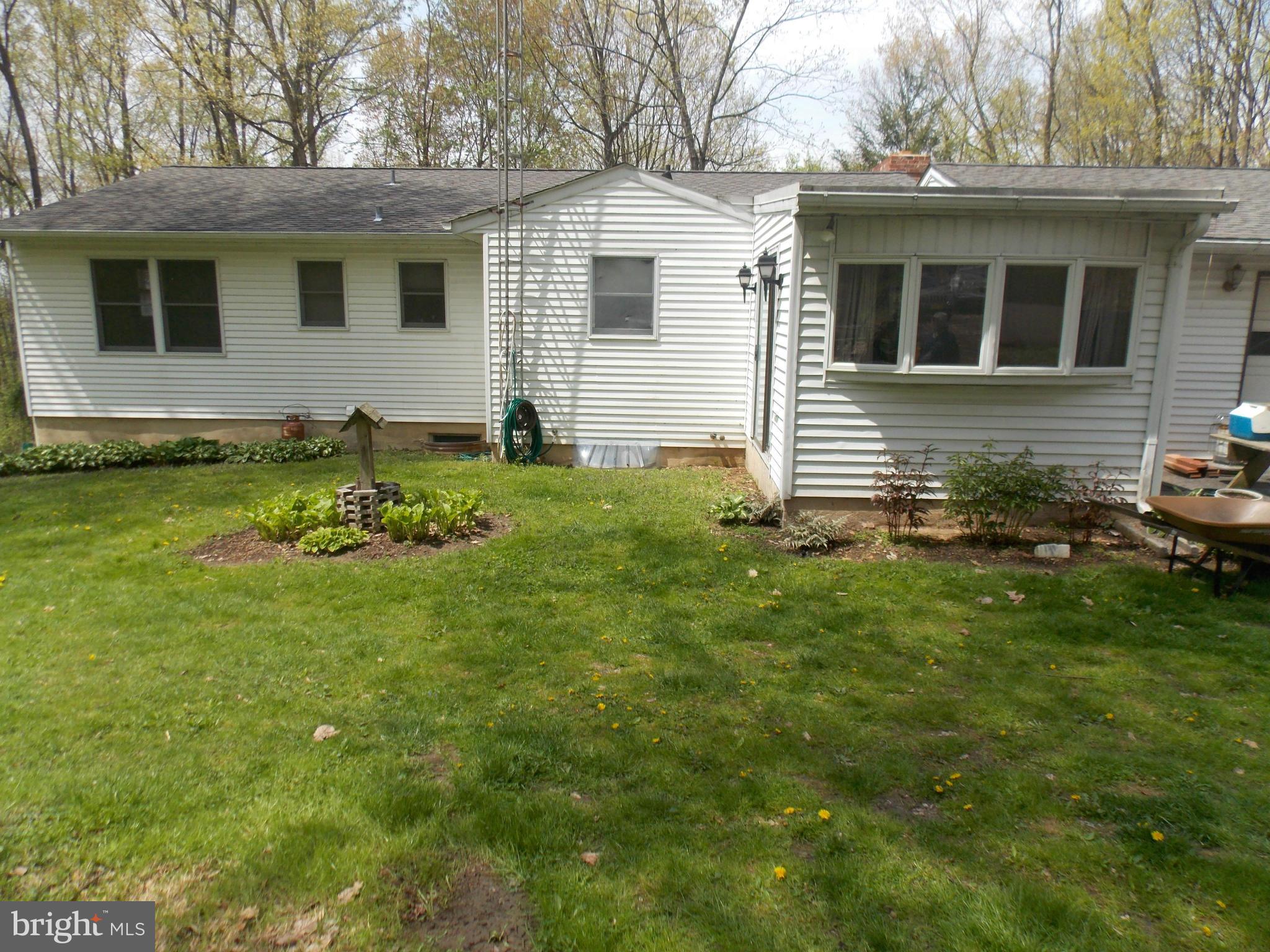 3039 Menges Mill Road Taneytown, MD 21787 - Photo 22 of 25 a backyard of a house with table and chairs