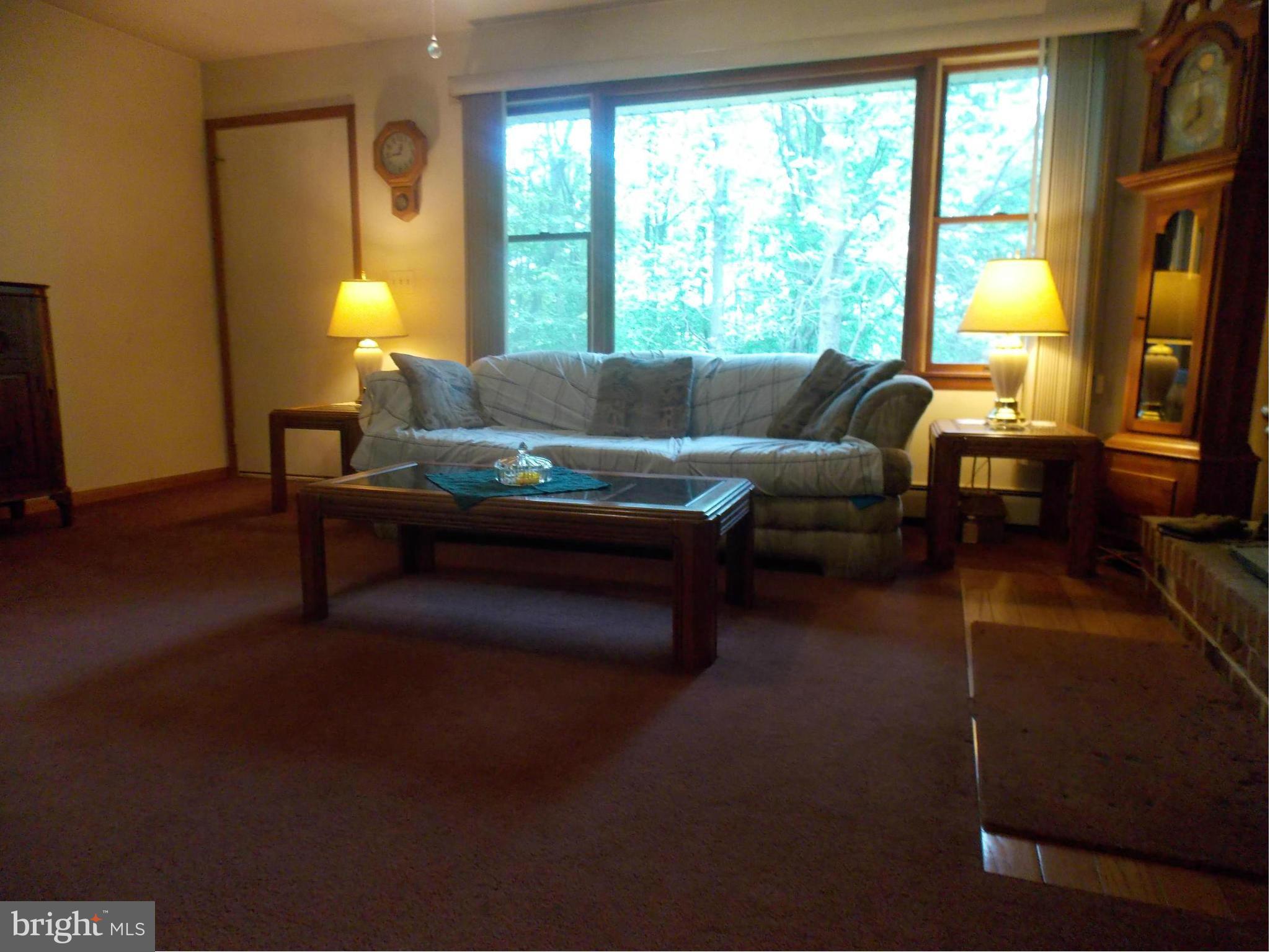 3039 Menges Mill Road Taneytown, MD 21787 - Photo 5 of 25 a living room with furniture and a large window