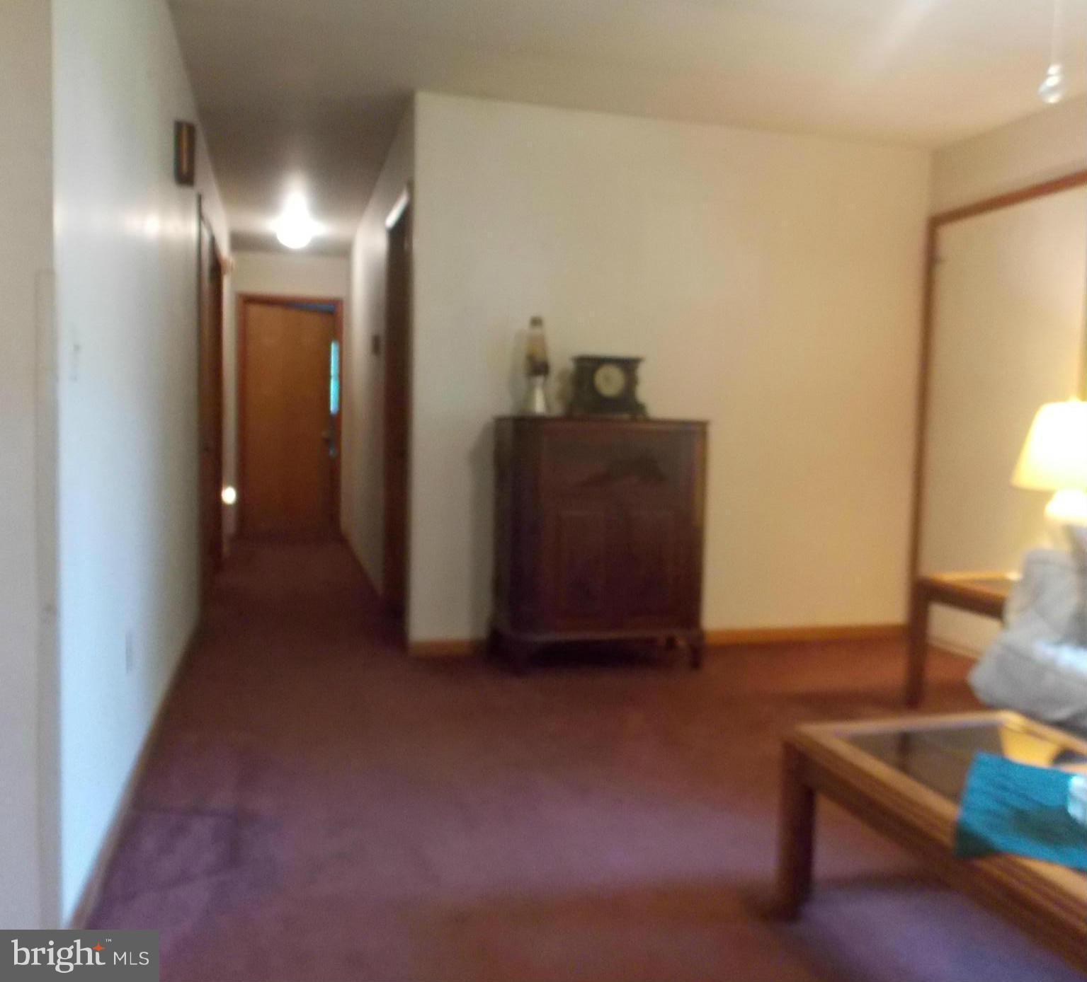 3039 Menges Mill Road Taneytown, MD 21787 - Photo 7 of 25 a view of a livingroom with furniture and a lamp