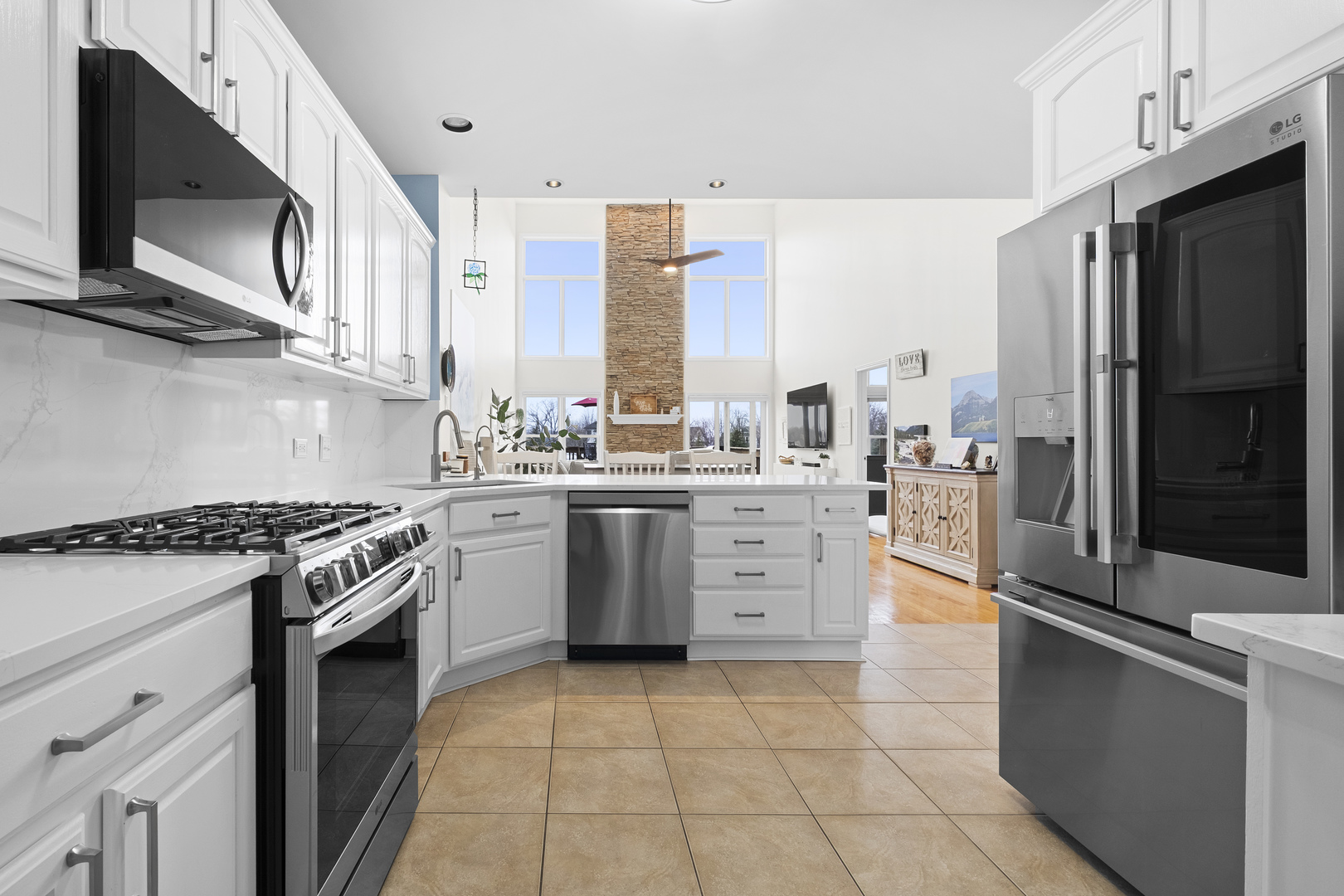 1076 Inverness Drive Antioch, IL 60002 - Photo 12 of 39 a kitchen with a stove a sink and a refrigerator