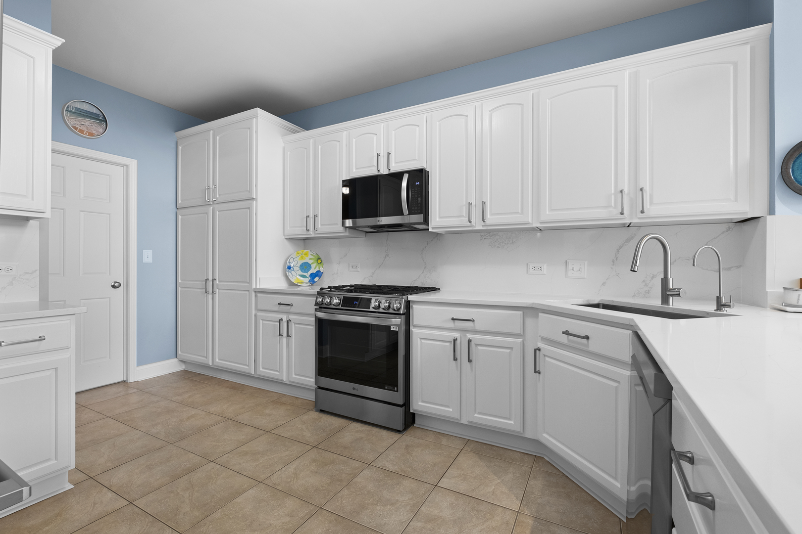 1076 Inverness Drive Antioch, IL 60002 - Photo 13 of 39 a kitchen with stainless steel appliances granite countertop a refrigerator sink and stove