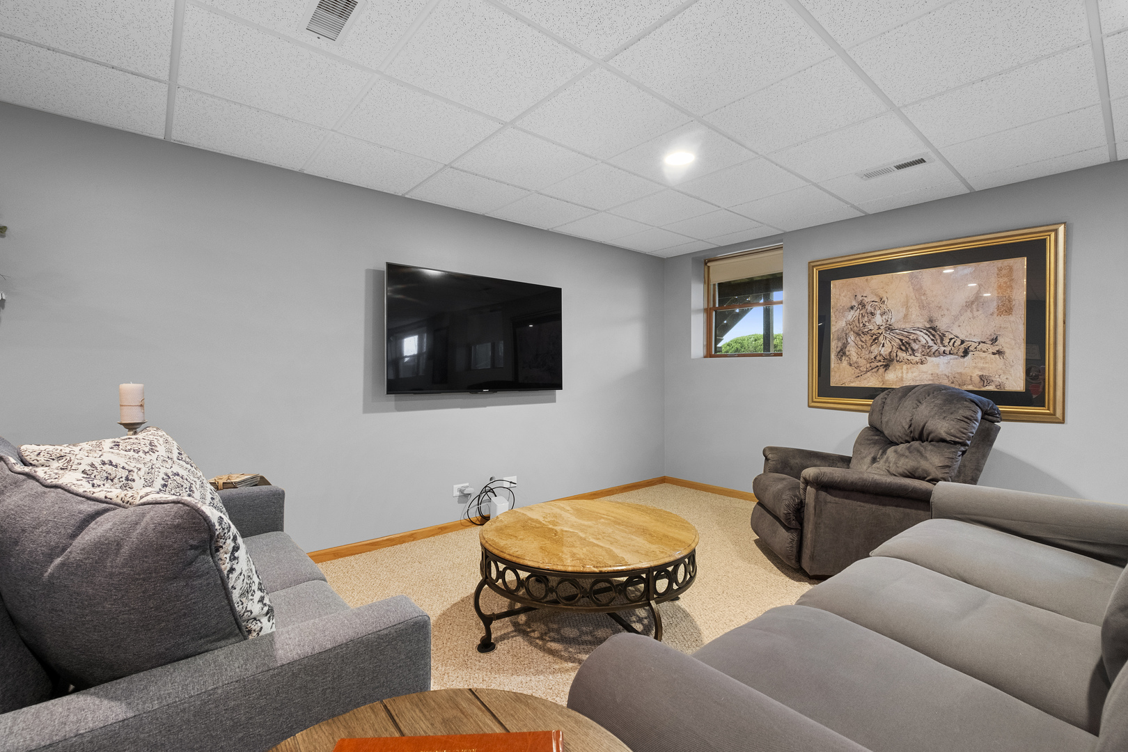 1076 Inverness Drive Antioch, IL 60002 - Photo 30 of 39 a living room with furniture and a flat screen tv