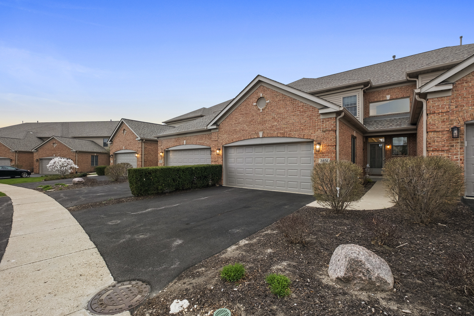 1076 Inverness Drive Antioch, IL 60002 - Photo 3 of 39 a front view of a house with a yard and garage
