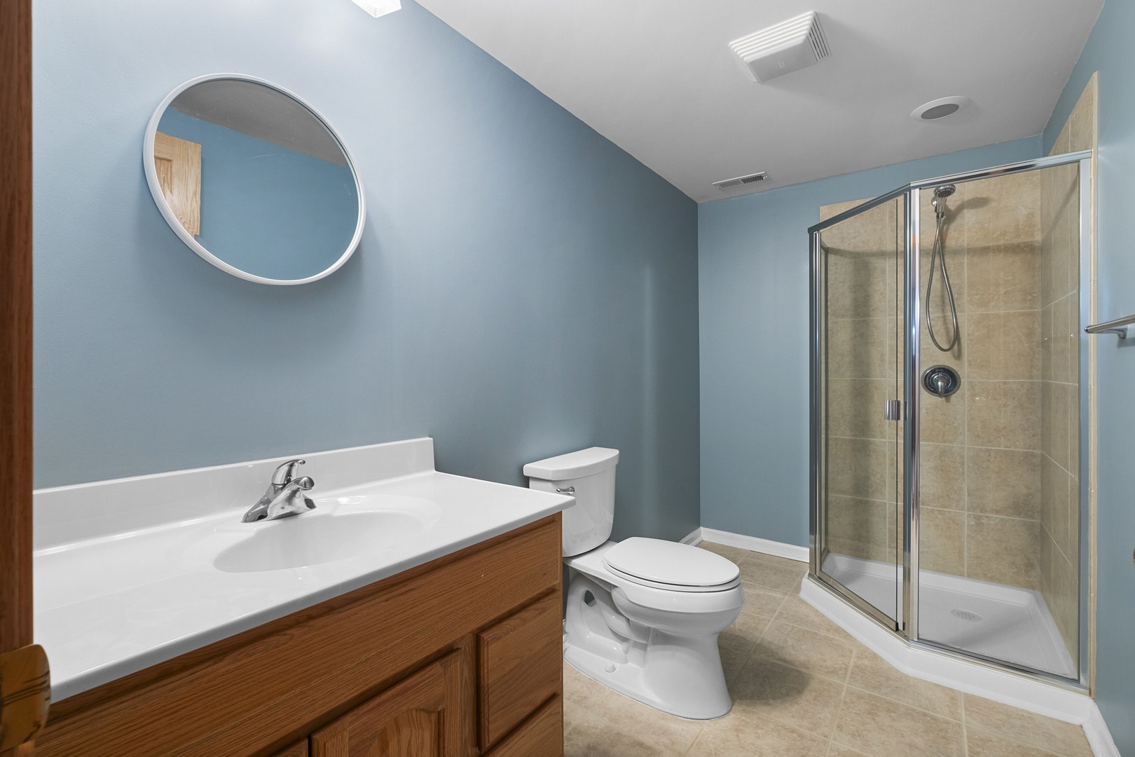 1076 Inverness Drive Antioch, IL 60002 - Photo 32 of 39 a bathroom with a sink a toilet and shower