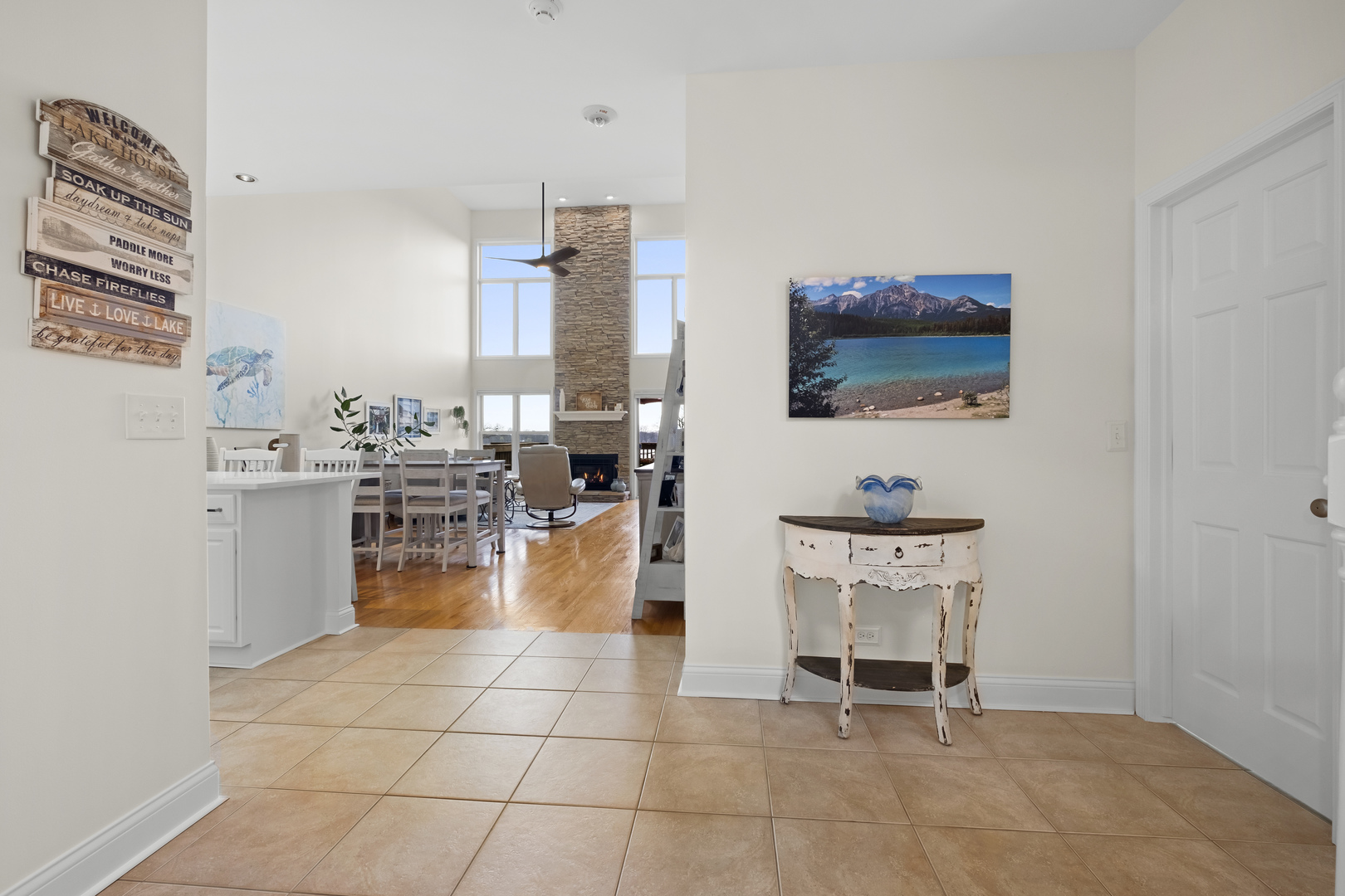 1076 Inverness Drive Antioch, IL 60002 - Photo 8 of 39 a living room with furniture a flat screen tv and kitchen view
