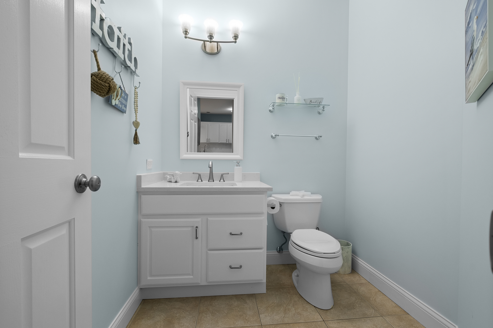 1076 Inverness Drive Antioch, IL 60002 - Photo 9 of 39 a bathroom with a toilet a sink and mirror