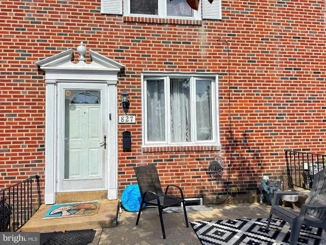 a front view of a house with a bench