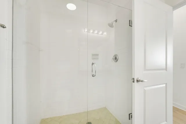 a balcony with a table and chairs