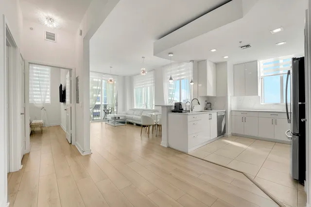a kitchen with granite countertop a sink and a stove top oven