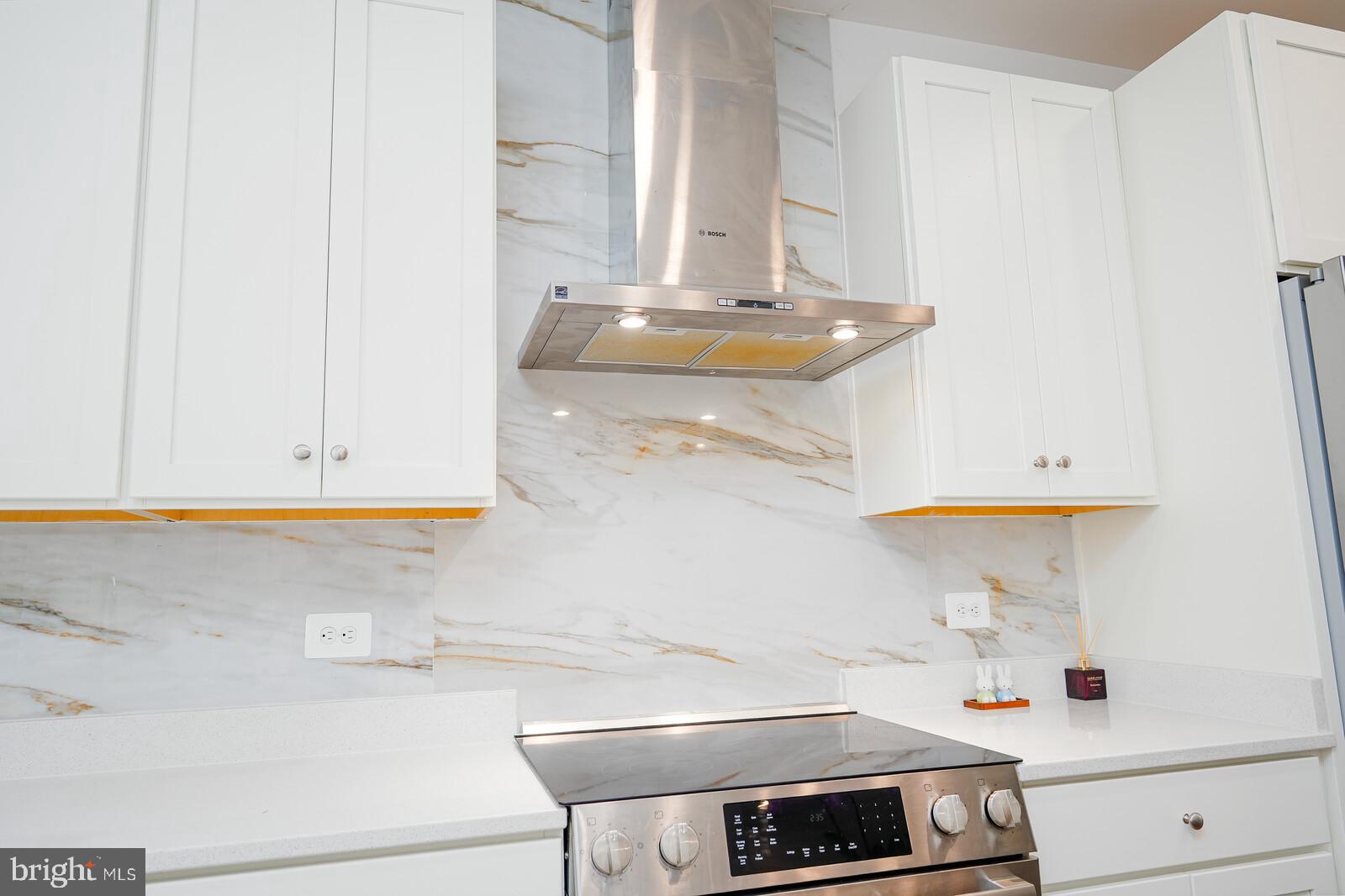 5345 Zenith Overlook Bethesda, MD 20816 - Photo 16 of 53 a kitchen with a sink and a stove