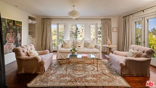 a living room with furniture and a rug
