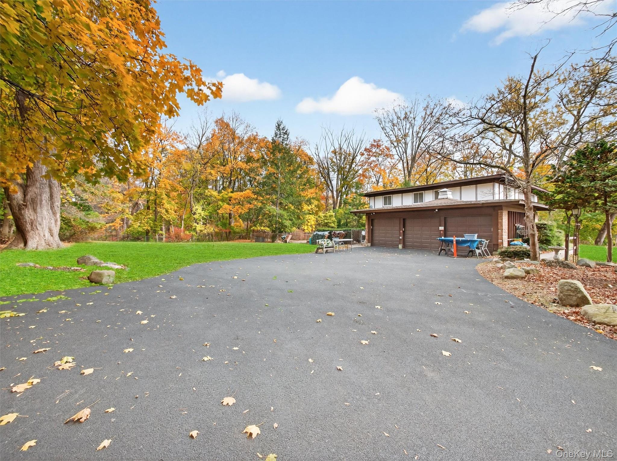 2 Kings Gate Road Suffern, NY 10901 - Photo 6 of 50 a view of a house with a yard and garage