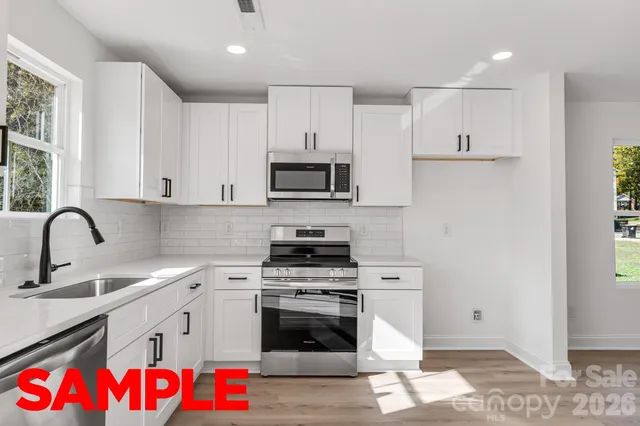 a view of room with window and ceiling fan