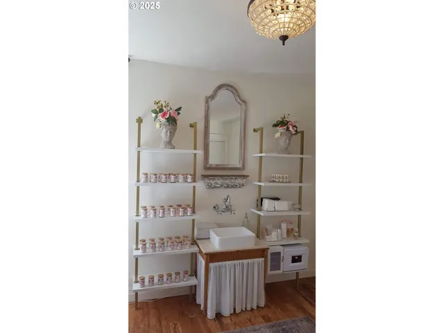 a view of a bathroom with a sink and mirror