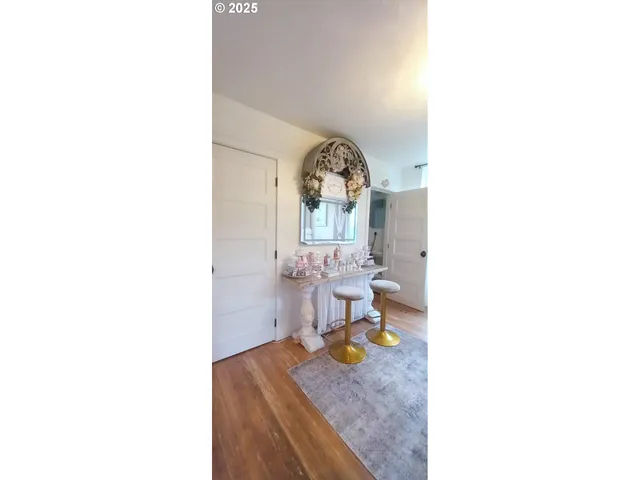 a view of living room with a table and chairs