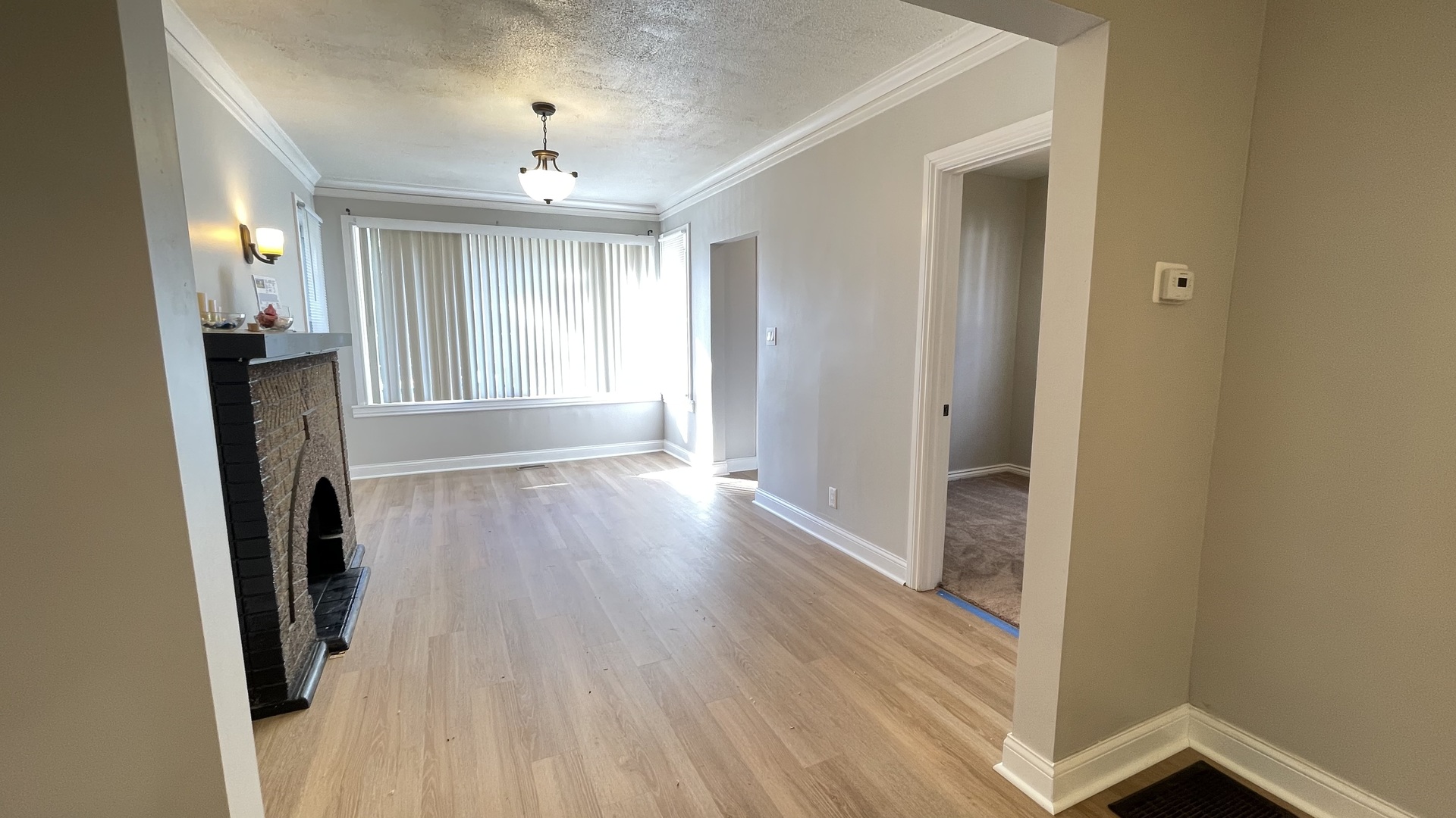 6511 South Vernon Avenue Chicago, IL 60637 - Photo 5 of 12 a view of a hallway with wooden floor and a window
