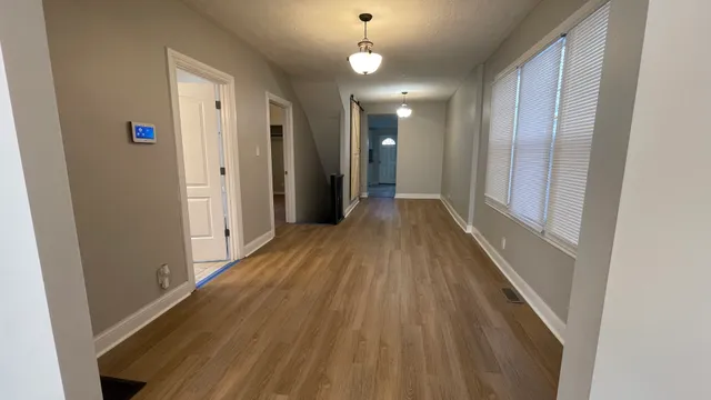 a view of gallery with wooden floor