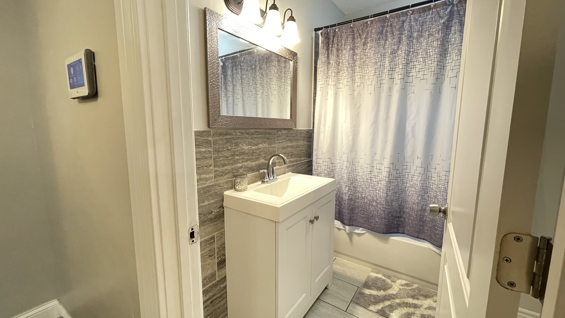 6511 South Vernon Avenue Chicago, IL 60637 - Photo 7 of 12 a bathroom with a sink a toilet and shower