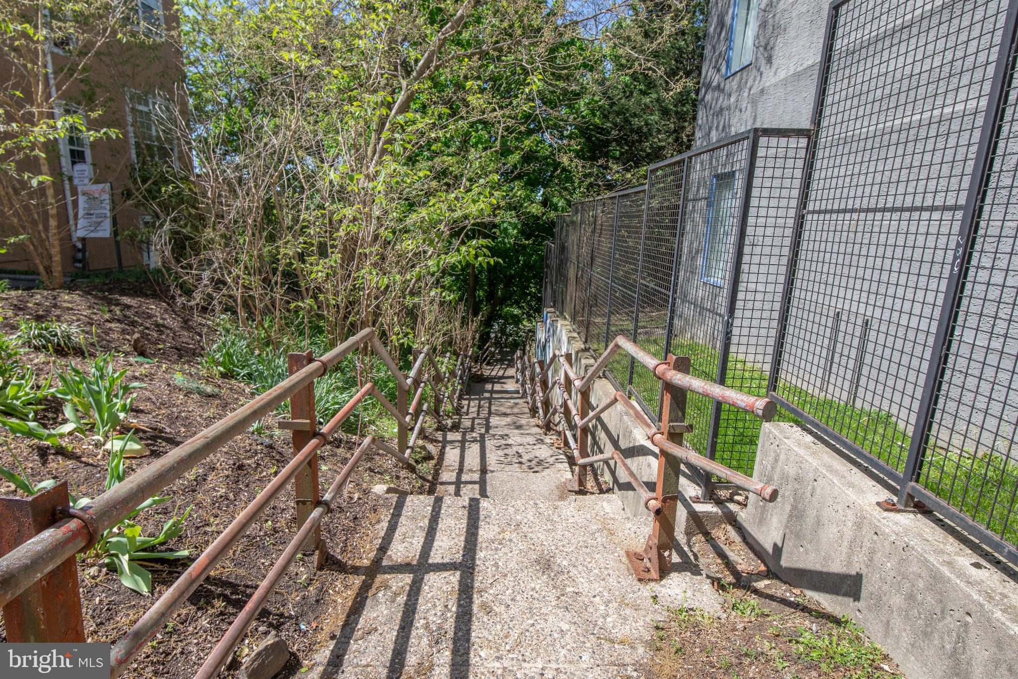 182 Gay Street, Unit 104 Philadelphia, PA 19128 - Photo 23 of 23 a view of balcony with wooden floor and fence