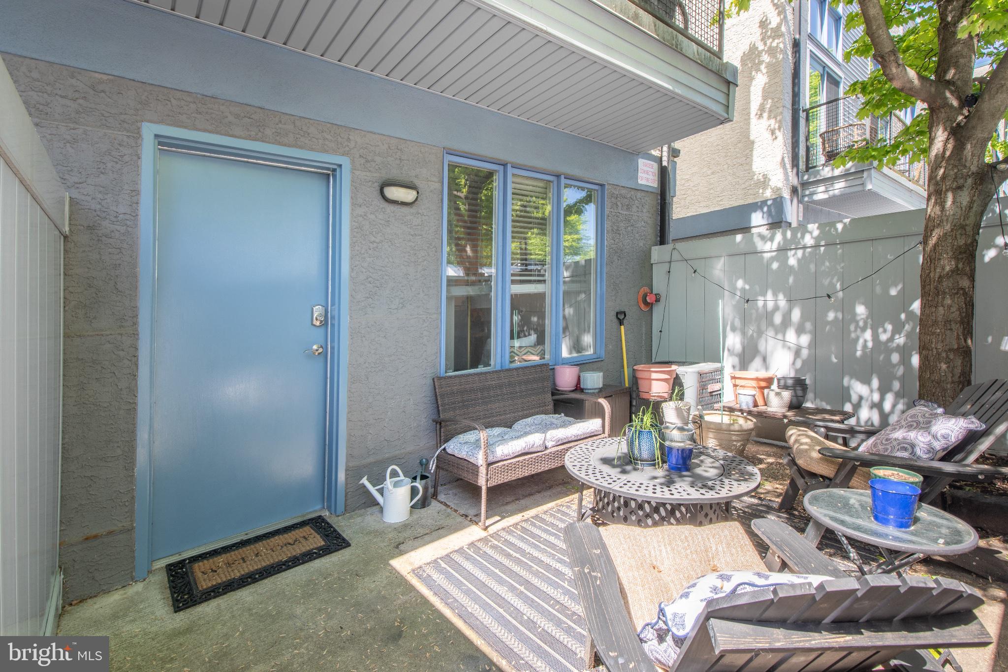 182 Gay Street, Unit 104 Philadelphia, PA 19128 - Photo 3 of 23 a living room with furniture and a window