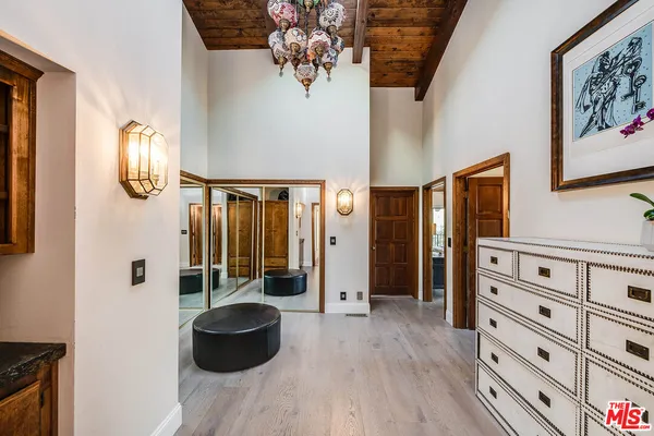 a spacious bathroom with a granite countertop sink and a mirror