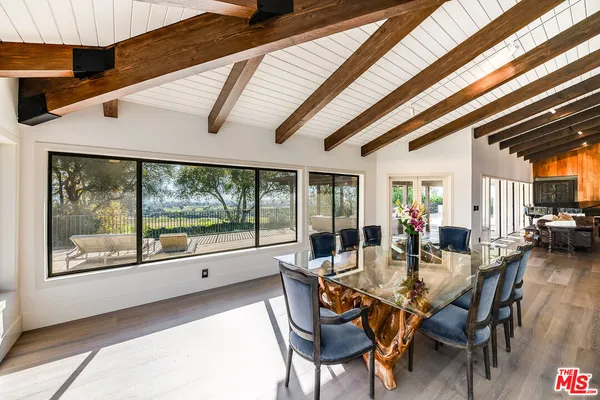 a empty refrigerator with white cabinets