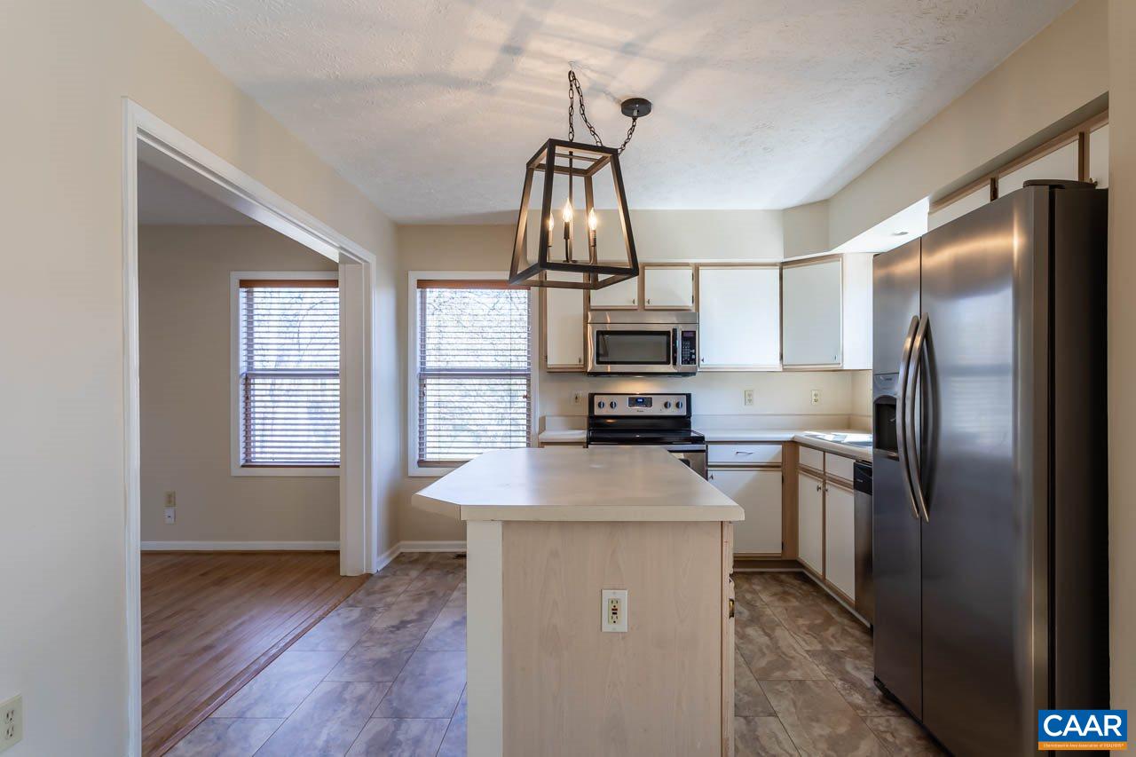 524 West Daffodil Road Ruckersville, VA 22968 - Photo 13 of 29 a kitchen with kitchen island a counter top space appliances and a window