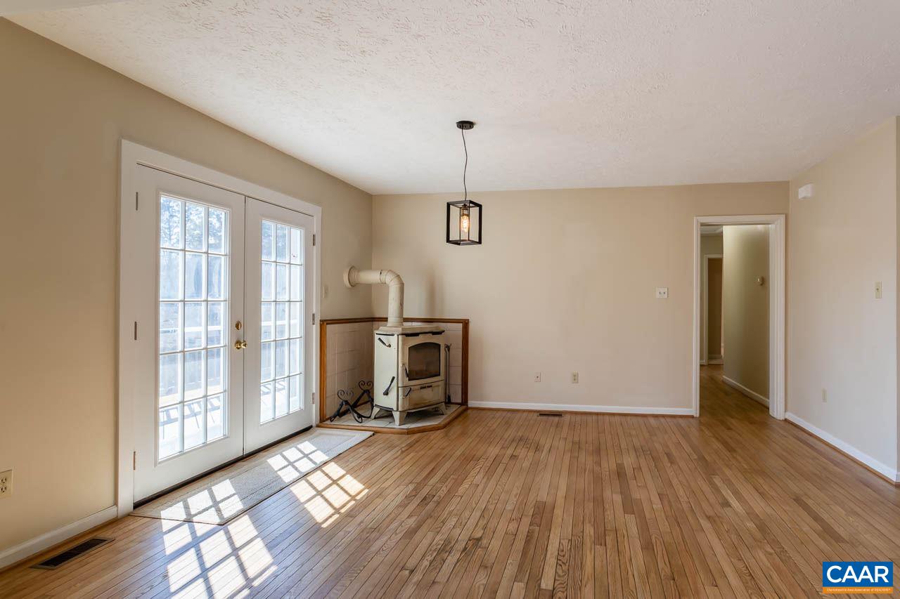 524 West Daffodil Road Ruckersville, VA 22968 - Photo 8 of 29 a view of empty room with wooden floor and fan