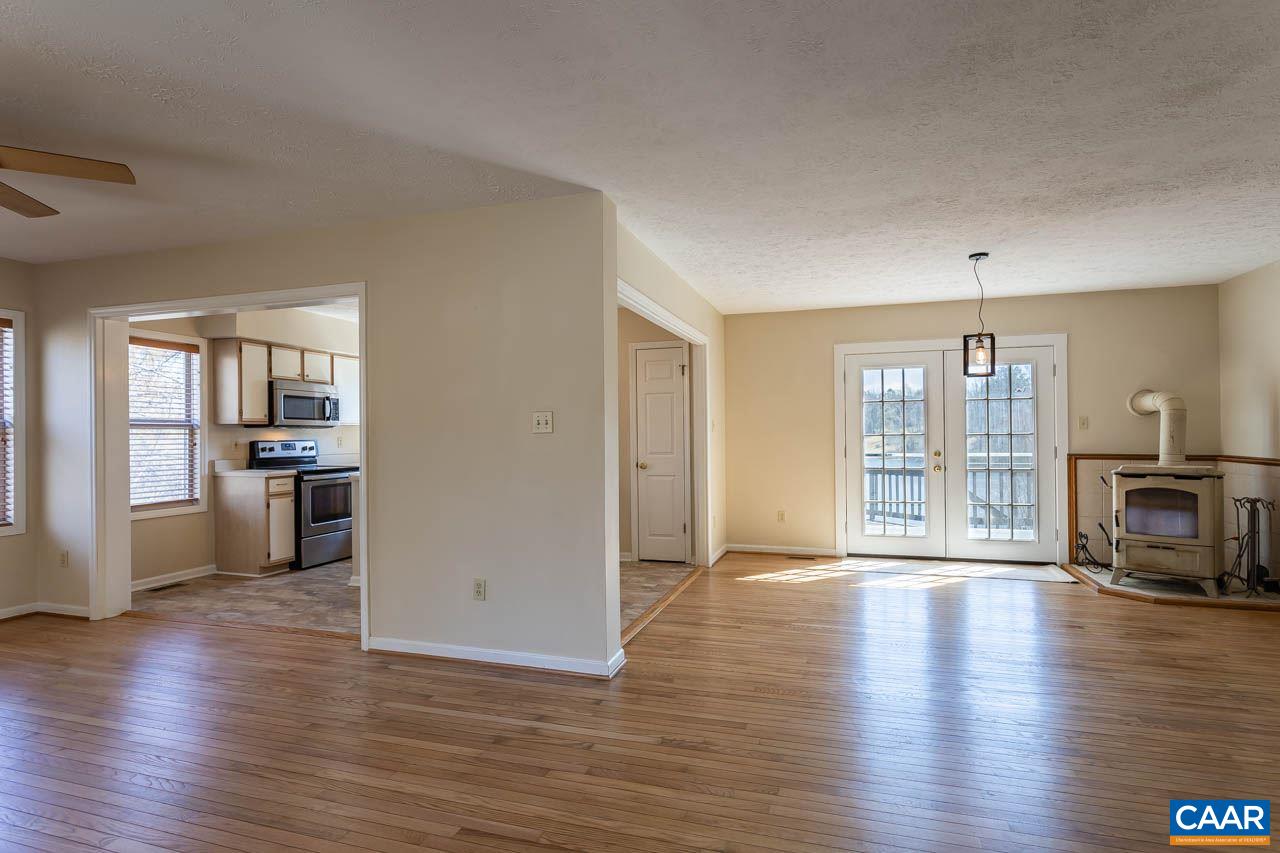 524 West Daffodil Road Ruckersville, VA 22968 - Photo 10 of 29 a view of a living room kitchen with furniture and a fireplace