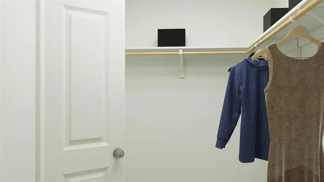 a bathroom with a shower and a mirror