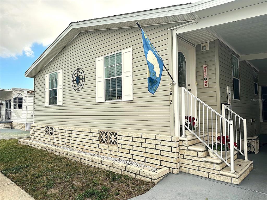 34612 Pine Drive Pinellas Park, FL 33781 - Photo 1 of 1 a view of a house with a yard and wooden fence