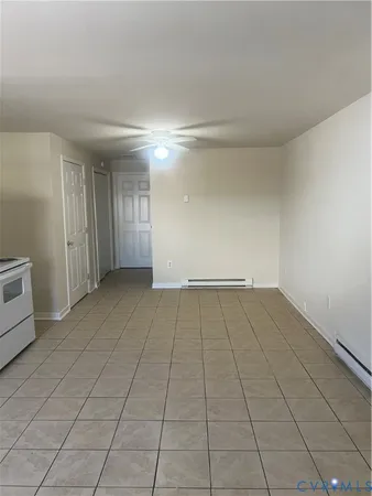 a view of a livingroom with an empty space and a sink