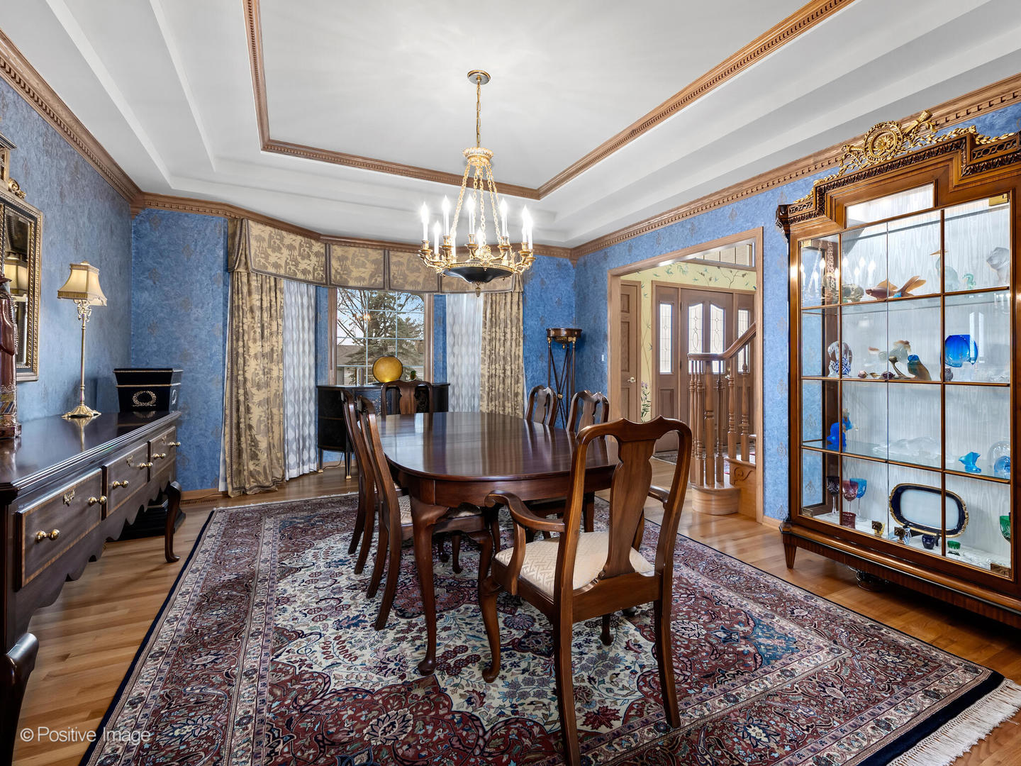 15-w601 81st Street Burr Ridge, IL 60527 - Photo 12 of 42 a dining room with furniture a chandelier and window
